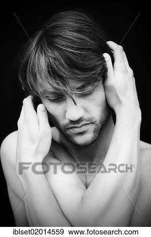 Stock Photo - Pensive young man with his hands on his head. Fotosearch