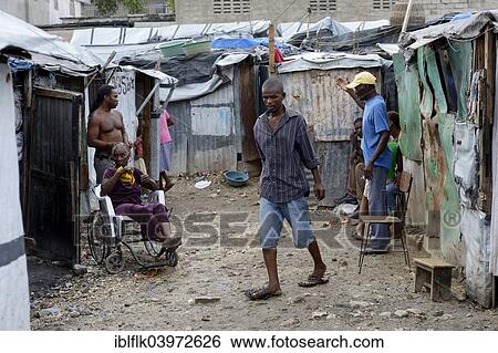 "People and a sick woman in a wheelchair, Camp Icare, camp for earthquake refugees, Fort National, Port-au-Prince, Haiti, North America" View Large Photo Image Stock Photograph - "People and a sick woman in a wheelchair, Camp Icare, camp for earthquake refugees, Fort National, Port-au-Prince, Haiti, North America". Fotosearch