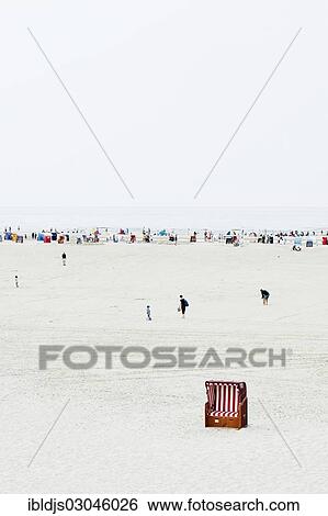 "People and beach chairs on the beach, Norddorf, Amrum, Amrum, North Frisian Islands, Schleswig-Holstein, Germany, Europe" View Large Photo Image Stock Photograph - "People and beach chairs on the beach, Norddorf, Amrum, Amrum, North Frisian Islands, Schleswig-Holstein, Germany, Europe". Fotosearch