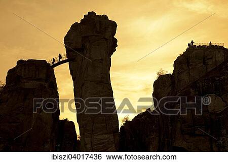 "People at Externsteine, sandstone rock formations, Horn-Bad Meinberg, Teutoburg Forest, North Rhine-Westphalia, Germany, Europe" View Large Photo Image Stock Photograph - "People at Externsteine, sandstone rock formations, Horn-Bad Meinberg, Teutoburg Forest, North Rhine-Westphalia, Germany, Europe". Fotosearch