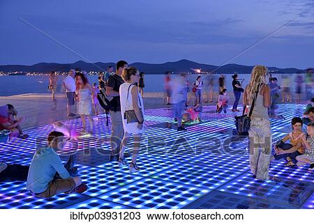 "People at the Monument to the Sun, Pozdrav Suncu, by architect Nikole Basica, at dusk, Zadar, Dalmatia, Croatia, Europe" View Large Photo Image Stock Image - "People at the Monument to the Sun, Pozdrav Suncu, by architect Nikole Basica, at dusk, Zadar, Dalmatia, Croatia, Europe". Fotosearch