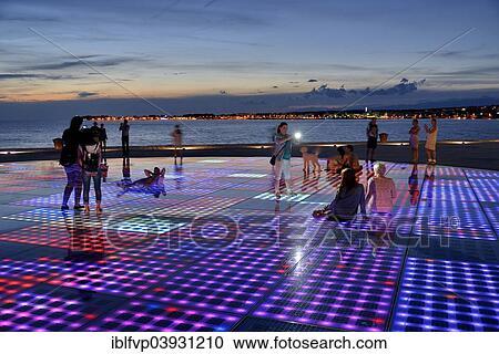 "People at the Monument to the Sun, Pozdrav Suncu, by architect Nikole Basica, at dusk, Zadar, Dalmatia, Croatia, Europe" View Large Photo Image Stock Image - "People at the Monument to the Sun, Pozdrav Suncu, by architect Nikole Basica, at dusk, Zadar, Dalmatia, Croatia, Europe". Fotosearch