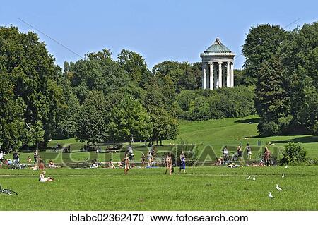 "People basking in the English Garden below the Monopteros, Munich, Bavaria, Germany, Europe" View Large Photo Image Stock Image - "People basking in the English Garden below the Monopteros, Munich, Bavaria, Germany, Europe". Fotosearch
