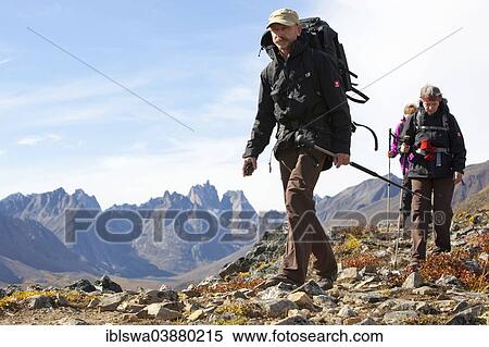 "People hiking in arctic or subalpine tundra, autumn, Tombstone Mountains Territorial Park, Yukon Territory, Canada, North America" View Large Photo Image Stock Photography - "People hiking in arctic or subalpine tundra, autumn, Tombstone Mountains Territorial Park, Yukon Territory, Canada, North America". Fotosearch