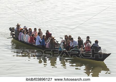 Stock Photo - "People in a boat on the Lemro River, Sittwe Division, Rakhine State, Myanmar, Asia". Fotosearch