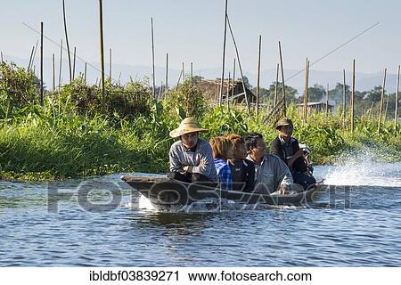 "People in a canoe, floating garden, field on the water, Inle Lake, Shan State, Myanmar, Asia" View Large Photo Image Stock Image - "People in a canoe, floating garden, field on the water, Inle Lake, Shan State, Myanmar, Asia". Fotosearch