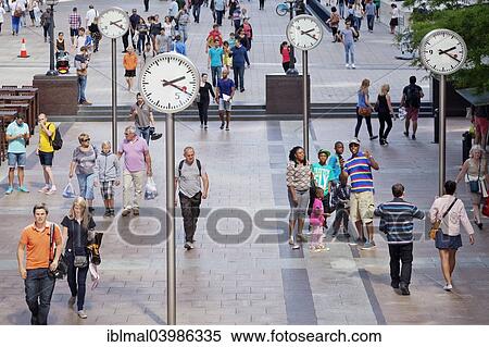 "People in a square with clocks, Canary Wharf, Docklands, London, England, United Kingdom, Europe" View Large Photo Image Stock Photography - "People in a square with clocks, Canary Wharf, Docklands, London, England, United Kingdom, Europe". Fotosearch
