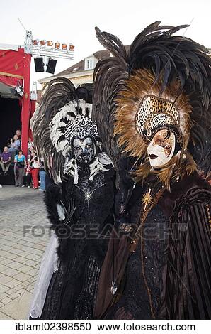Stock Image - "People in Baroque costumes, masks and elaborate headdresses with feathers, Venetian Fair, Ludwigsburg, Baden-Wuerttemberg, Germany, Europe". Fotosearch