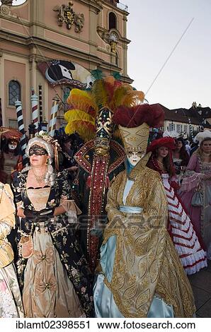 "People in Baroque costumes, masks and elaborate jewellery, Stadtkirche church at back, Venetian Fair, Ludwigsburg, Baden-Wuerttemberg, Germany, Europe" View Large Photo Image Stock Image - "People in Baroque costumes, masks and elaborate jewellery, Stadtkirche church at back, Venetian Fair, Ludwigsburg, Baden-Wuerttemberg, Germany, Europe". Fotosearch