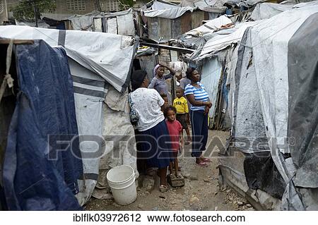 Stock Image - "People in Camp Icare, a camp for earthquake refugees, Fort National, Port-au-Prince, Haiti, North America". Fotosearch