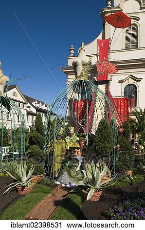 "People in costumes and masks in a Baroque landscaped garden, Dreieinigkeitskirche, Trinity Church, at back, Venetian Fair, Ludwigsburg, Baden-Wuerttemberg, Germany, Europe" View Large Photo Image Stock Image - "People in costumes and masks in a Baroque landscaped garden, Dreieinigkeitskirche, Trinity Church, at back, Venetian Fair, Ludwigsburg, Baden-Wuerttemberg, Germany, Europe". Fotosearch