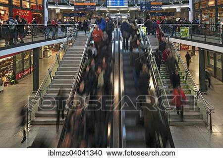 "People in motion on escalators in the main station, Nuremberg, Middle Franconia, Bavaria, Germany, Europe" View Large Photo Image Stock Image - "People in motion on escalators in the main station, Nuremberg, Middle Franconia, Bavaria, Germany, Europe". Fotosearch