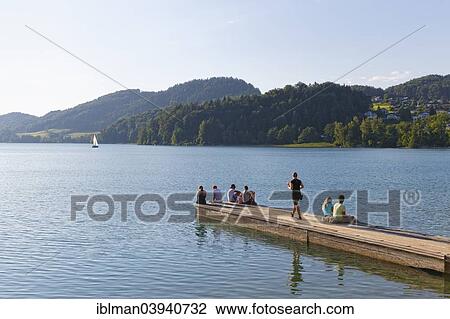 "People on a jetty, Fuschlsee lake, Fuschl am See, Salzkammergut, Salzburg state, Salzburg State, Austria, Europe" View Large Photo Image Stock Image - "People on a jetty, Fuschlsee lake, Fuschl am See, Salzkammergut, Salzburg state, Salzburg State, Austria, Europe". Fotosearch