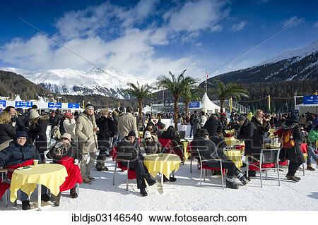 Stock Image - "People on the frozen Lake St. Moritz, White Turf Horse Races 2013, St. Moritz, Engadin, Graubunden, Switzerland, Europe". Fotosearch
