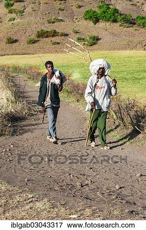 Stock Photo - "People on the road to Lalibela market, Lalibela, Amhara Region, Ethiopia, Africa". Fotosearch