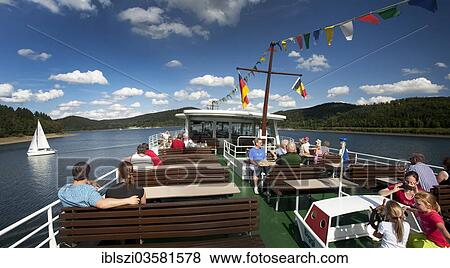 "People on the top deck of the excursion ship Westfalen on the Bigge reservoir, Olpe, North Rhine-Westphalia, Germany, Europe" View Large Photo Image Stock Photo - "People on the top deck of the excursion ship Westfalen on the Bigge reservoir, Olpe, North Rhine-Westphalia, Germany, Europe". Fotosearch