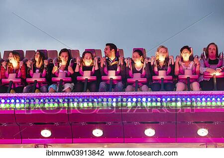 "People sitting in a ride, Munich Spring Festival, Theresienwiese, Munich, Bavaria, Germany, Europe" View Large Photo Image Stock Image - "People sitting in a ride, Munich Spring Festival, Theresienwiese, Munich, Bavaria, Germany, Europe". Fotosearch