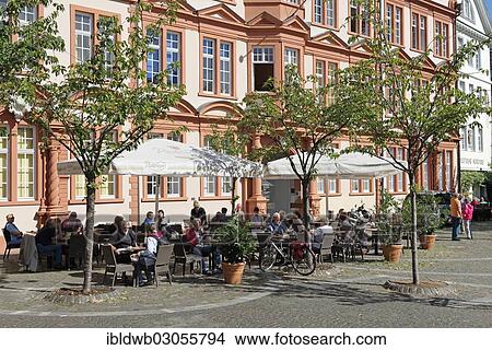 "People sitting in front of the older part of the Gutenberg Museum, house """"Zum Romischen Kaiser"""", Mainz, Rhineland-Palatinate, Germany, Europe" View Large Photo Image Picture - "People sitting in front of the older part of the Gutenberg Museum, house """"Zum Romischen Kaiser"""", Mainz, Rhineland-Palatinate, Germany, Europe". Fotosearch