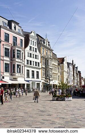 "People strolling around on one of the shopping streets of Rostock, Mecklenburg-Western Pomerania, Germany, Europe" View Large Photo Image Stock Photo - "People strolling around on one of the shopping streets of Rostock, Mecklenburg-Western Pomerania, Germany, Europe". Fotosearch