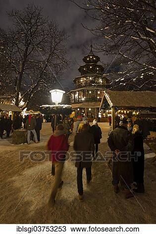 "People strolling through the Christmas market at the Chinese Tower in the English Garden, Munich, Upper Bavaria, Bavaria, Germany, Europe" View Large Photo Image Stock Image - "People strolling through the Christmas market at the Chinese Tower in the English Garden, Munich, Upper Bavaria, Bavaria, Germany, Europe". Fotosearch