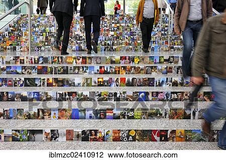 "People walking on stairs covered with photos, Photokina 2012, Cologne, North Rhine-Westphalia, Germany, Europe" View Large Photo Image Stock Image - "People walking on stairs covered with photos, Photokina 2012, Cologne, North Rhine-Westphalia, Germany, Europe". Fotosearch