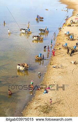 "People washing and taking water from the Mandare river, Berenty, Tolagnaro, Toliara Province, Madagascar, Africa" View Large Photo Image Stock Photography - "People washing and taking water from the Mandare river, Berenty, Tolagnaro, Toliara Province, Madagascar, Africa". Fotosearch
