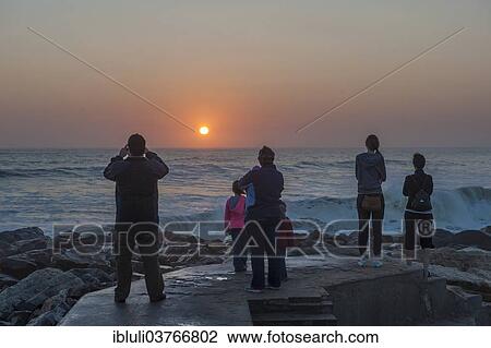 "People watching the sunset over the ocean, Swakopmund, Erongo Region, Namibia, Africa" View Large Photo Image Stock Image - "People watching the sunset over the ocean, Swakopmund, Erongo Region, Namibia, Africa". Fotosearch