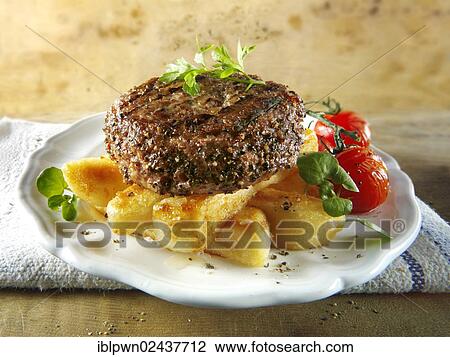 Peppered beef burger on thick cut chips View Large Photo Image Stock Image - Peppered beef burger on thick cut chips. Fotosearch