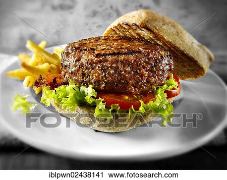 Peppered beef burger with chips and wholemeal bun View Large Photo Image Stock Image - Peppered beef burger with chips and wholemeal bun. Fotosearch