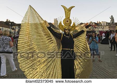 "Performer wearing a golden mask and a golden costume, Venezianische Messe, Venetian festival, Ludwigsburg, Baden-Wuerttemberg, Germany, Europe" View Large Photo Image Stock Photography - "Performer wearing a golden mask and a golden costume, Venezianische Messe, Venetian festival, Ludwigsburg, Baden-Wuerttemberg, Germany, Europe". Fotosearch
