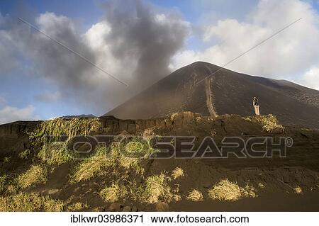 "Person in front of Mount Yasur volcano, Tanna Island, Vanuatu, Oceania" View Large Photo Image Stock Image - "Person in front of Mount Yasur volcano, Tanna Island, Vanuatu, Oceania". Fotosearch