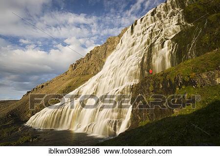 "Person standing in front of the Dynjandi waterfall, also Fjallfoss, Westfjords, Iceland, Europe" View Large Photo Image Stock Photograph - "Person standing in front of the Dynjandi waterfall, also Fjallfoss, Westfjords, Iceland, Europe". Fotosearch
