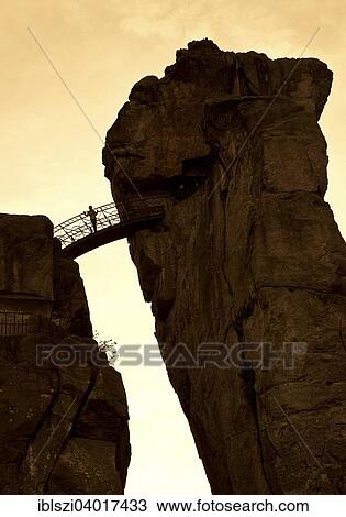 "Person standing on a bridge, Externsteine, sandstone rock formations, Horn-Bad Meinberg, Teutoburg Forest, North Rhine-Westphalia, Germany, Europe" View Large Photo Image Stock Image - "Person standing on a bridge, Externsteine, sandstone rock formations, Horn-Bad Meinberg, Teutoburg Forest, North Rhine-Westphalia, Germany, Europe". Fotosearch