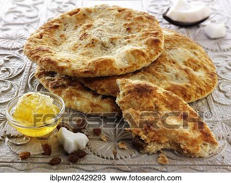 "Peshwari Naan, coconut sultanas and honey bread, Indian cuisine" View Large Photo Image Stock Image - "Peshwari Naan, coconut sultanas and honey bread, Indian cuisine". Fotosearch