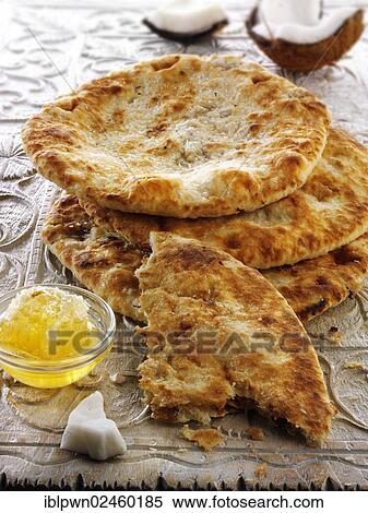 "Peshwari Naan, coconut, sultanas and honey bread, Indian cuisine" View Large Photo Image Stock Photography - "Peshwari Naan, coconut, sultanas and honey bread, Indian cuisine". Fotosearch