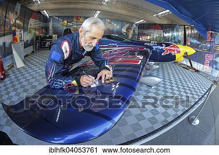 "Peter Besenyei posing with his plane before the Red Bull Air Race, Red Bull Ring, Spielberg, Styria, Austria, Europe" View Large Photo Image Stock Image - "Peter Besenyei posing with his plane before the Red Bull Air Race, Red Bull Ring, Spielberg, Styria, Austria, Europe". Fotosearch