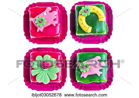 Petits Fours with good luck symbols for the New Year View Large Photo Image Stock Photo - Petits Fours with good luck symbols for the New Year. Fotosearch