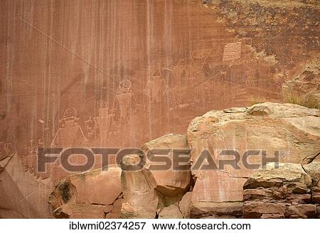 "Petroglyphs etched in sandstone, symbols, mural paintings, depicting Fremont, Anasazi, Navajo and Anglo-Saxon cultures, prehistoric and historic rock art, Capitol Reef National Park, Utah, Southwestern USA" View Large Photo Image Stock Photo - "Petroglyphs etched in sandstone, symbols, mural paintings, depicting Fremont, Anasazi, Navajo and Anglo-Saxon cultures, prehistoric and historic rock art, Capitol Reef National Park, Utah, Southwestern USA". Fotosearch