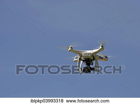 Stock Photo - "Phantom Drone with a camera, in flight". Fotosearch