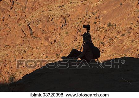 "Photographer in the Tiras Mountains, Namtib, Karas Region, Namibia, Africa" View Large Photo Image Stock Photo - "Photographer in the Tiras Mountains, Namtib, Karas Region, Namibia, Africa". Fotosearch
