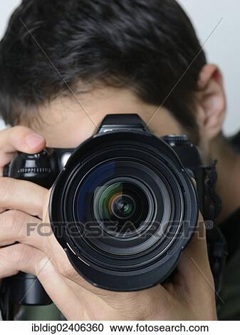 Stock Image - Photographer taking a picture. Fotosearch