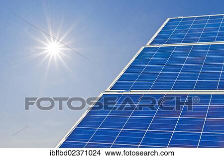Picture - "Photovoltaic power plants against blue sky and bright sun, Nentmannsdorf, Saxony, Germany, Europe". Fotosearch