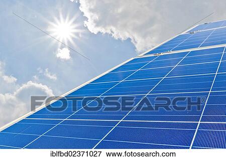 "Photovoltaic power plants against blue sky with clouds and bright sun, Nentmannsdorf, Saxony, Germany, Europe" View Large Photo Image Stock Photo - "Photovoltaic power plants against blue sky with clouds and bright sun, Nentmannsdorf, Saxony, Germany, Europe". Fotosearch