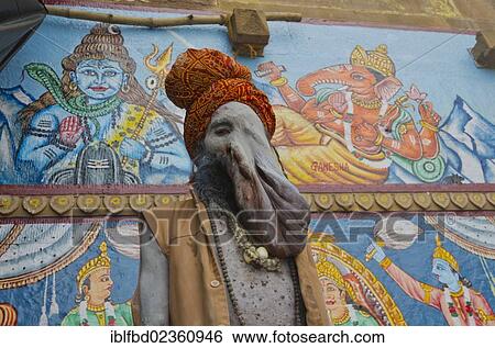 Stock Photograph - "Physically disabled Sadhu, holy man, at one of the ghats of the historic city of Varanasi, India, Asia". Fotosearch