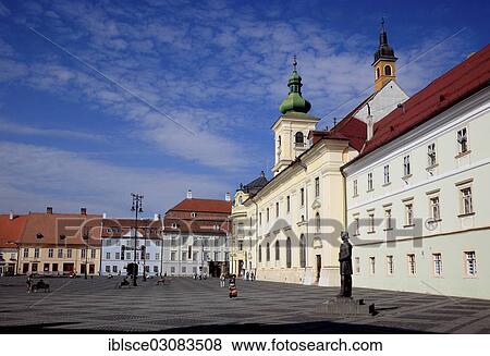 Stock Photo - "Piata Mare or Great Square with the Catholic Garrison Church and the Gheorghe Lazar Memorial, Sibiu oder Hermannstadt, Siebenburgen, Romania, Europe". Fotosearch