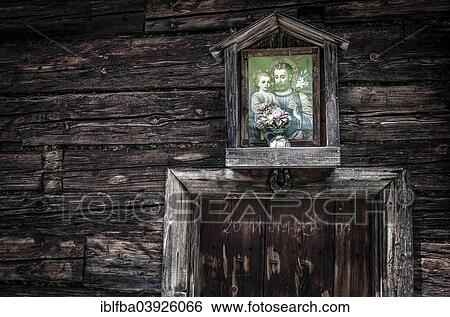 Stock Photograph - "Picture of a saint on a mountain hut, Rauris, Salzburg State, Austria,, Europe". Fotosearch