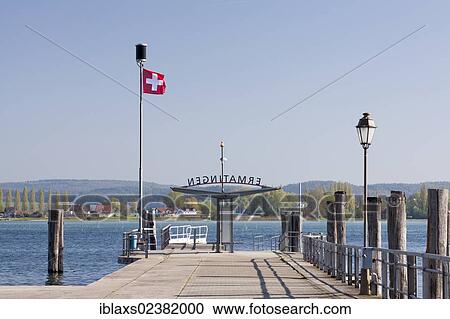 "Pier at Ermatingen with Reichenau island on the horizon at back, Lake Constance, Ermatingen, Canton of Thurgau, Switzerland, Europe, PublicGround, Europe" View Large Photo Image Stock Image - "Pier at Ermatingen with Reichenau island on the horizon at back, Lake Constance, Ermatingen, Canton of Thurgau, Switzerland, Europe, PublicGround, Europe". Fotosearch