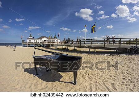 Stock Image - "Pier with a grand piano on a beach, Ahlbeck, Usedom, Mecklenburg-Western Pomerania, Germany, Europe". Fotosearch