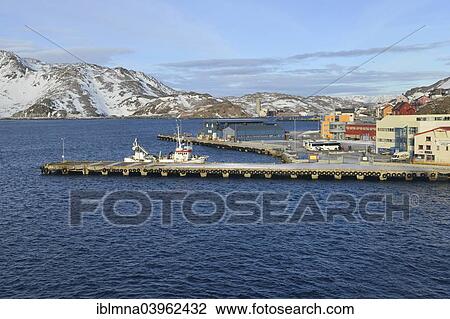 Stock Image - "Pier with boat in bay, Honningsvag, Mageroya island, Finnmark County, Norway, Europe". Fotosearch