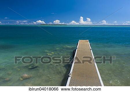 "Pier with Cocos island in the back, Cocos Lagoon, Merizo, Guam, US Territory, Pacific, Oceania" View Large Photo Image Stock Photograph - "Pier with Cocos island in the back, Cocos Lagoon, Merizo, Guam, US Territory, Pacific, Oceania". Fotosearch